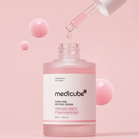 Gotero del serum con gota rosa